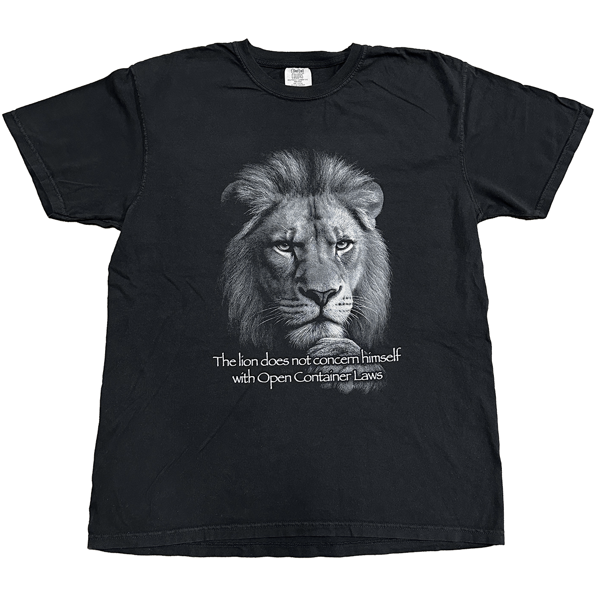 Black t-shirt with a lion graphic and text on a white background "the lion does not concern himself with open container laws" shirt by crying in the club shirts