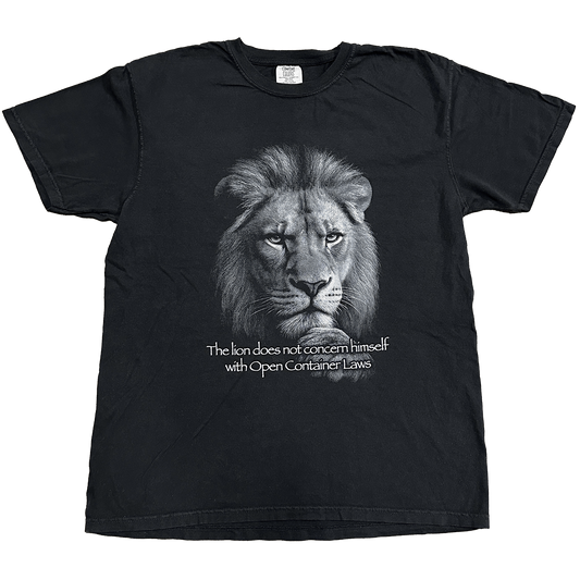 Black t-shirt with a lion graphic and text on a white background "the lion does not concern himself with open container laws" shirt by crying in the club shirts