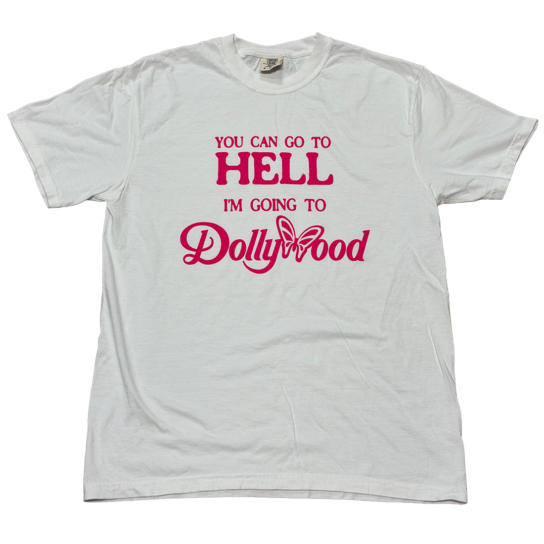 A light gray crewneck t-shirt with a pink graphic text print reading 'YOU CAN GO TO HELL I'M GOING TO Dollywood' on the front, displayed flat against a white background.