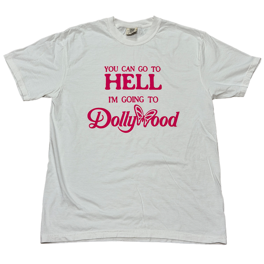 A light gray crewneck t-shirt with a pink graphic text print reading 'YOU CAN GO TO HELL I'M GOING TO Dollywood' on the front, displayed flat against a white background.